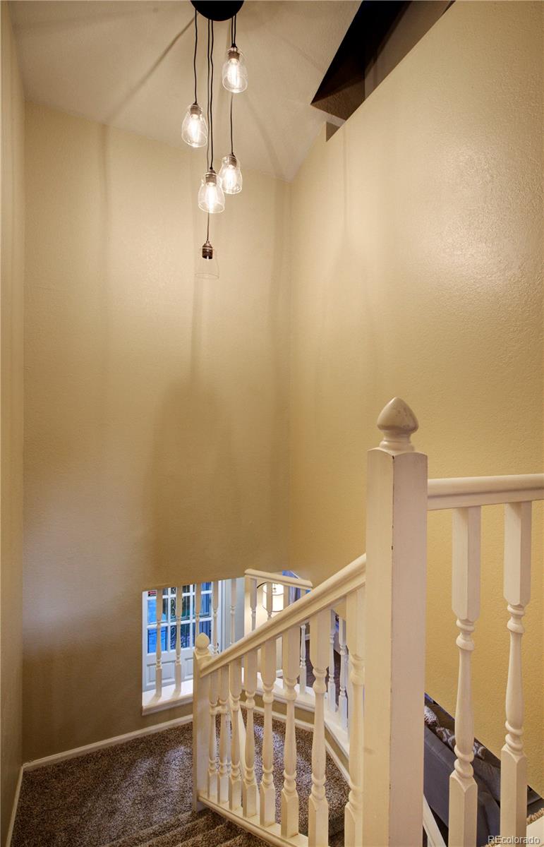 2138 Ranch Drive Westminster, CO 80234 - Photo 14 of 31 a view of entryway with wooden floor
