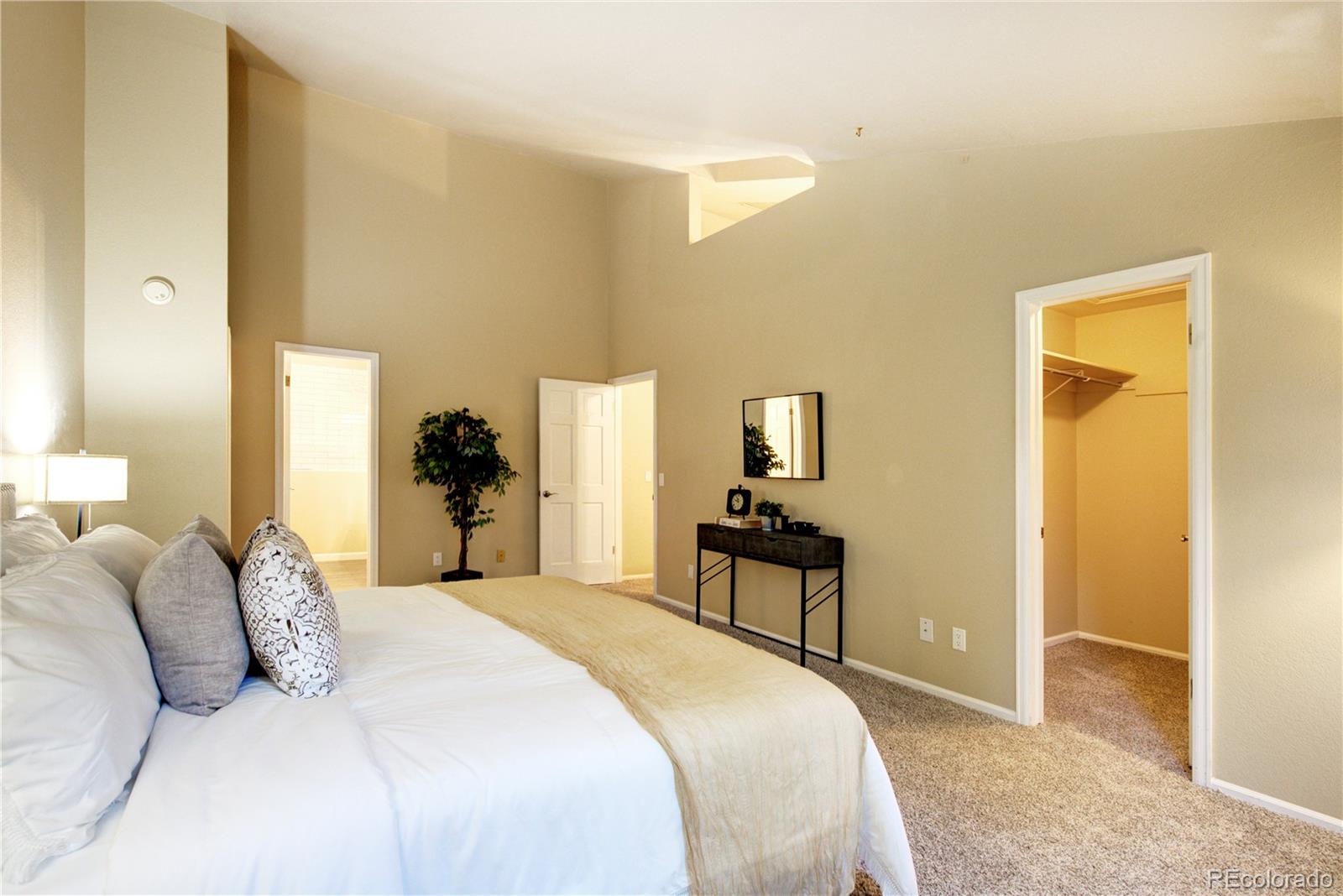 2138 Ranch Drive Westminster, CO 80234 - Photo 16 of 31 a bedroom with a bed and wooden floor