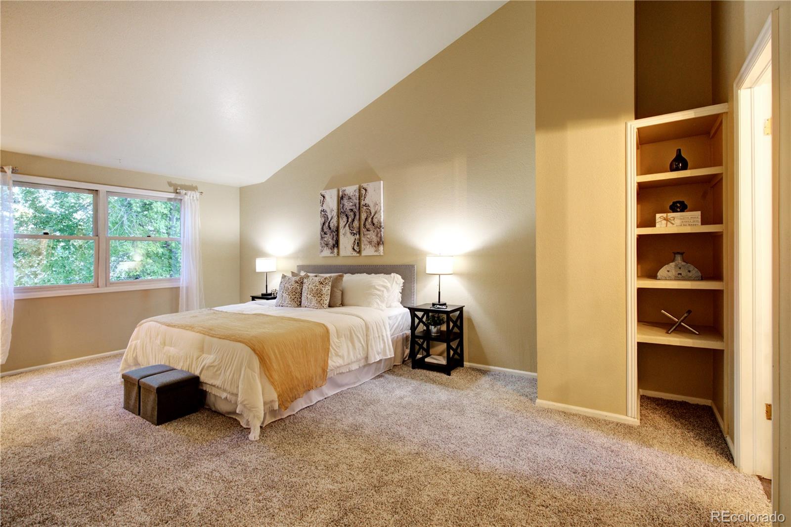 2138 Ranch Drive Westminster, CO 80234 - Photo 17 of 31 a spacious bedroom with a bed and a window