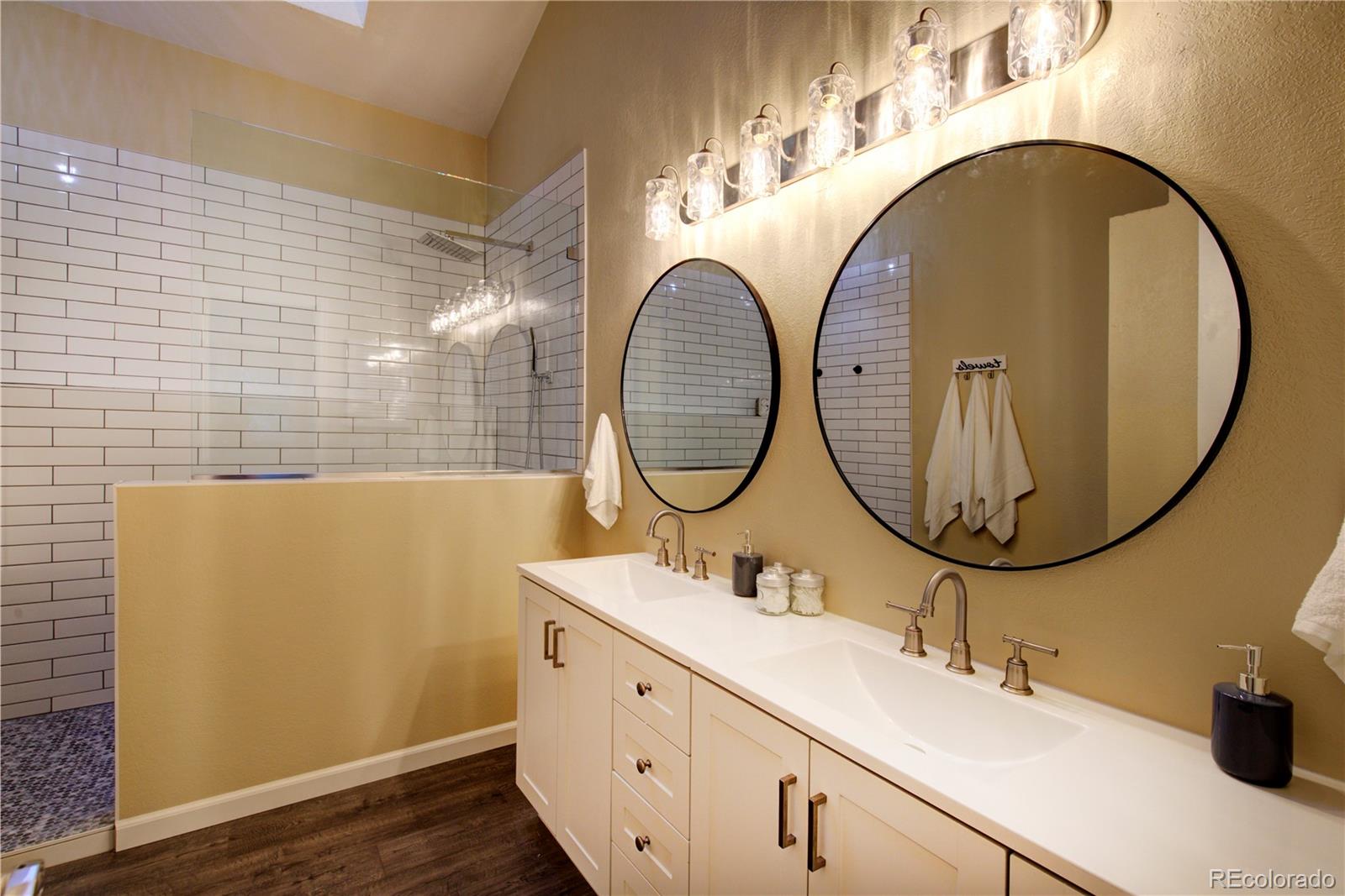 2138 Ranch Drive Westminster, CO 80234 - Photo 19 of 31 a bathroom with a sink and a mirror