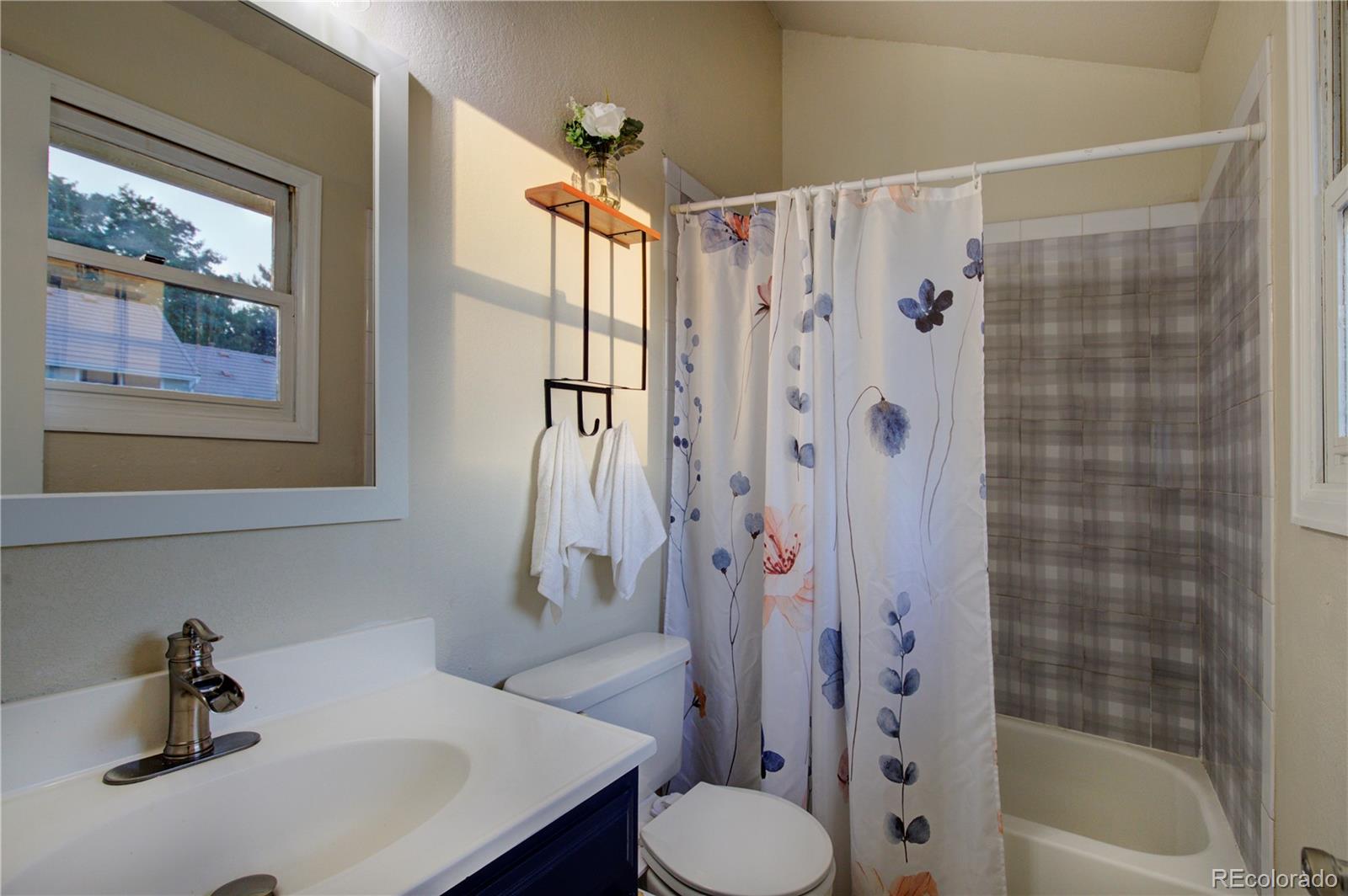2138 Ranch Drive Westminster, CO 80234 - Photo 22 of 31 a bathroom with a sink toilet and shower