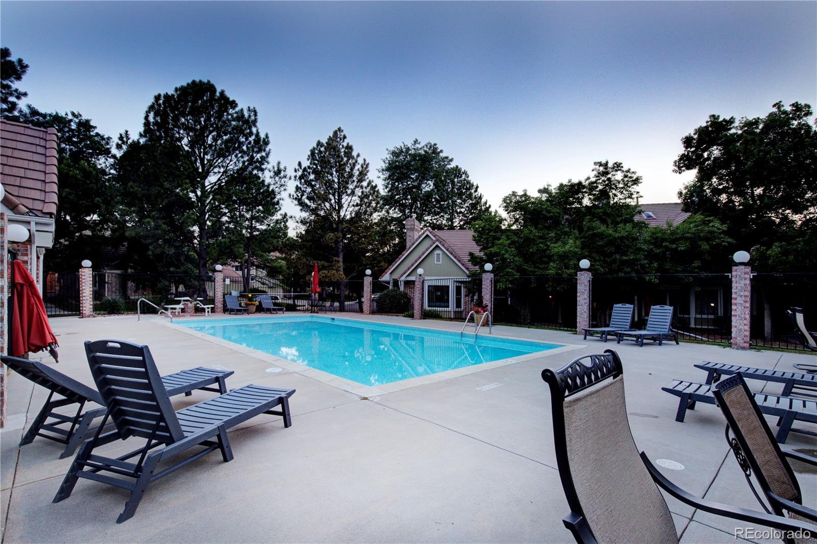 2138 Ranch Drive Westminster, CO 80234 - Photo 30 of 31 a view of a patio with swimming pool and sitting area