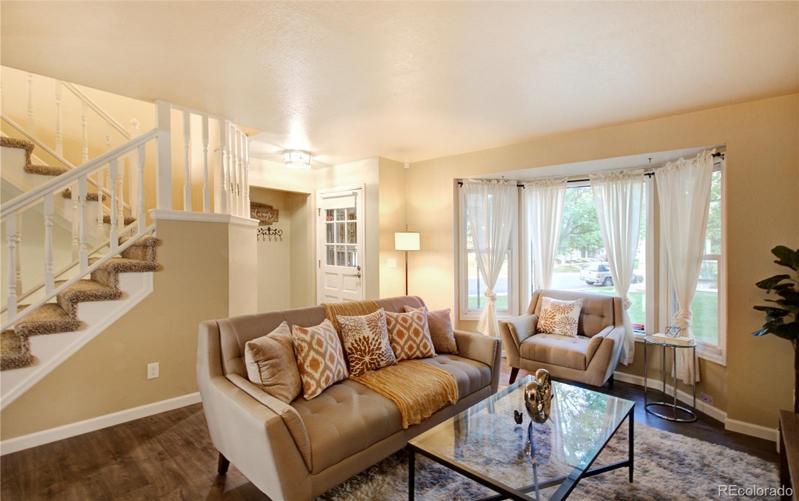 2138 Ranch Drive Westminster, CO 80234 - Photo 4 of 31 a living room with furniture and a large window