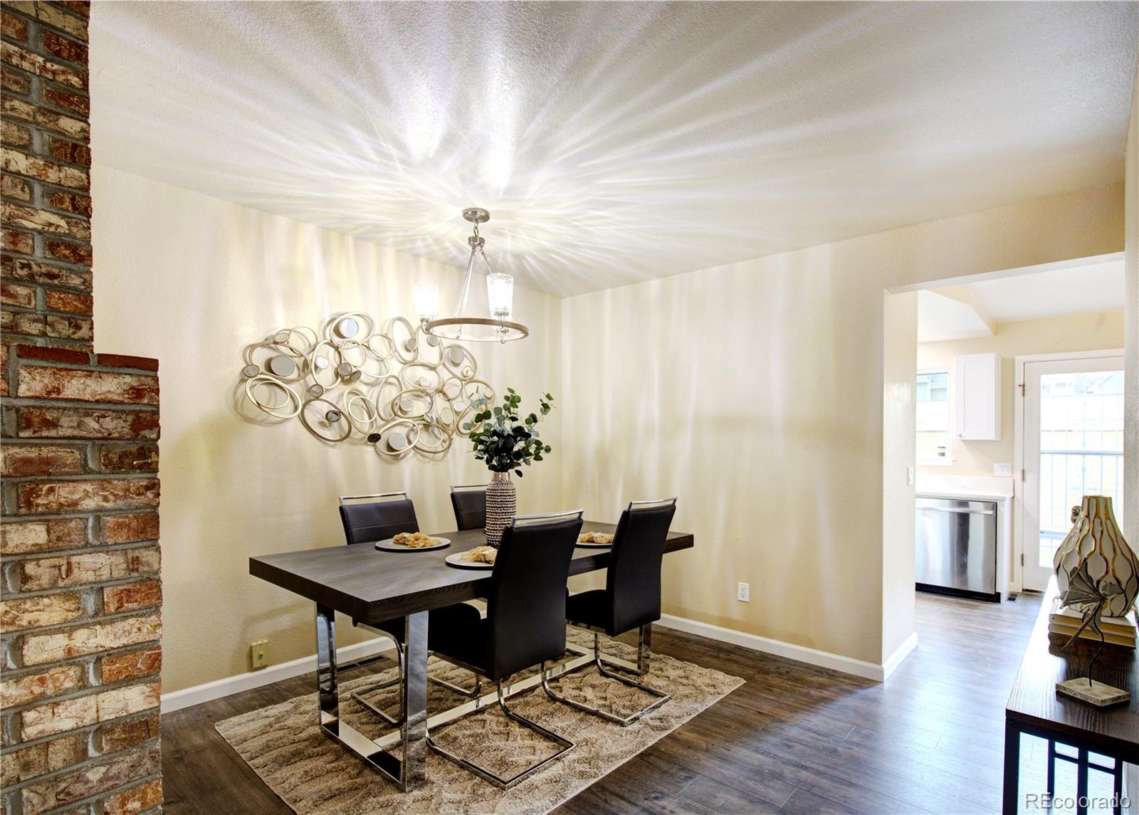 2138 Ranch Drive Westminster, CO 80234 - Photo 6 of 31 a view of a dining room with furniture and wooden floor