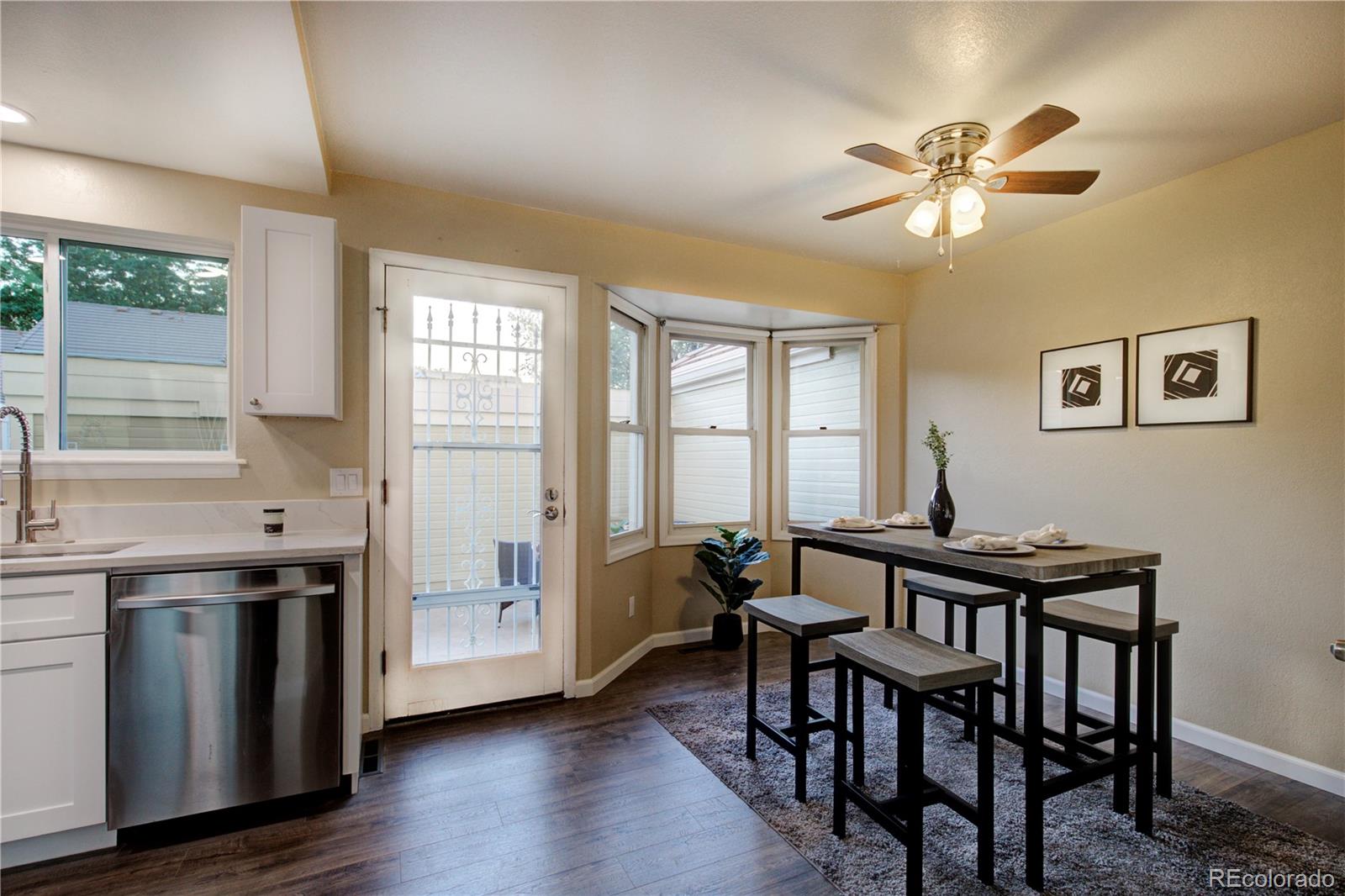 2138 Ranch Drive Westminster, CO 80234 - Photo 9 of 31 a view of a dining room with furniture window and wooden floor