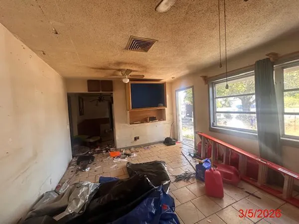 a bed room with a bed and a window