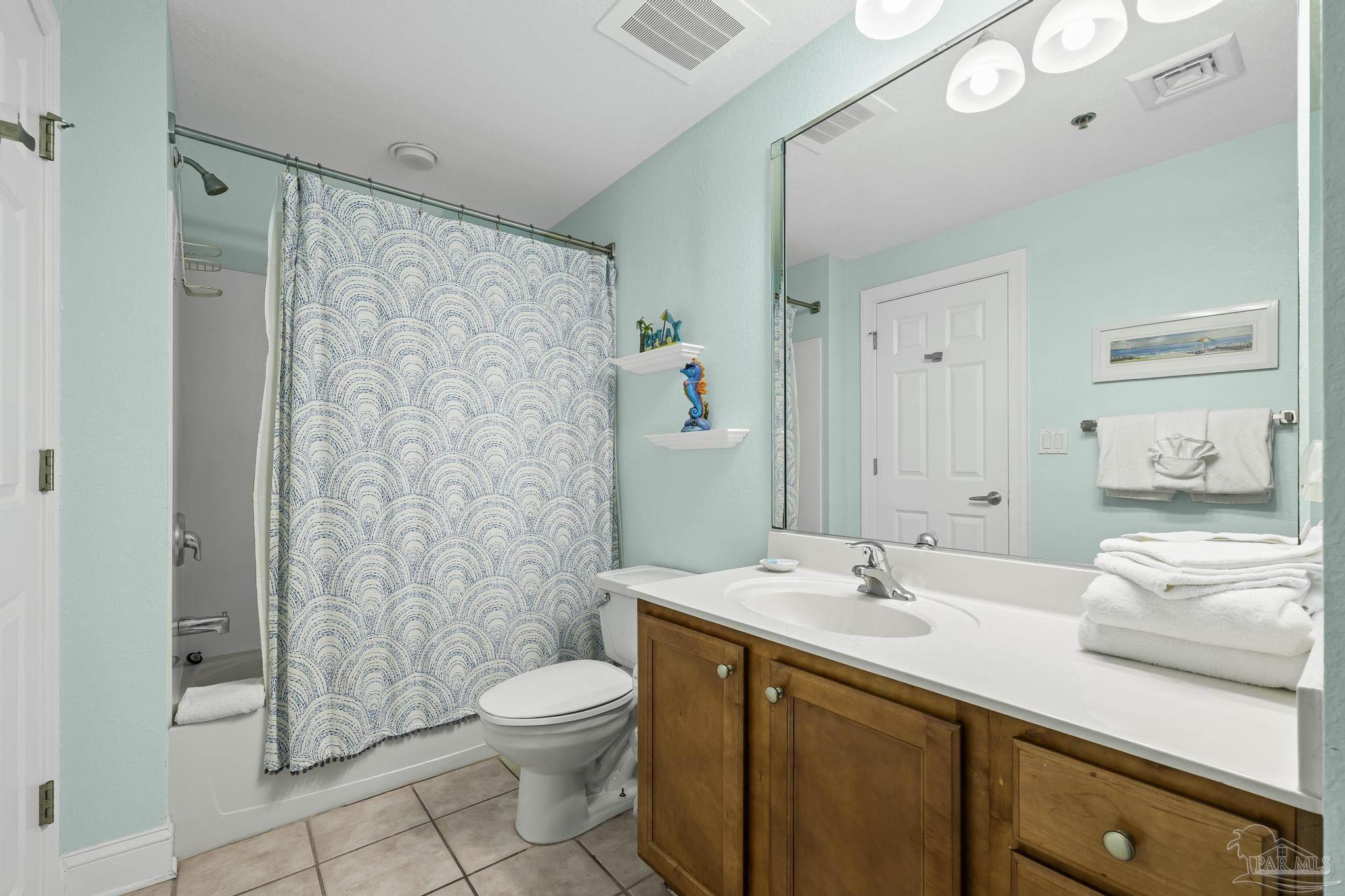 850 Fort Pickens Road, Unit 1230 Pensacola Beach, FL 32561 - Photo 11 of 67 a bathroom with a sink a toilet and shower