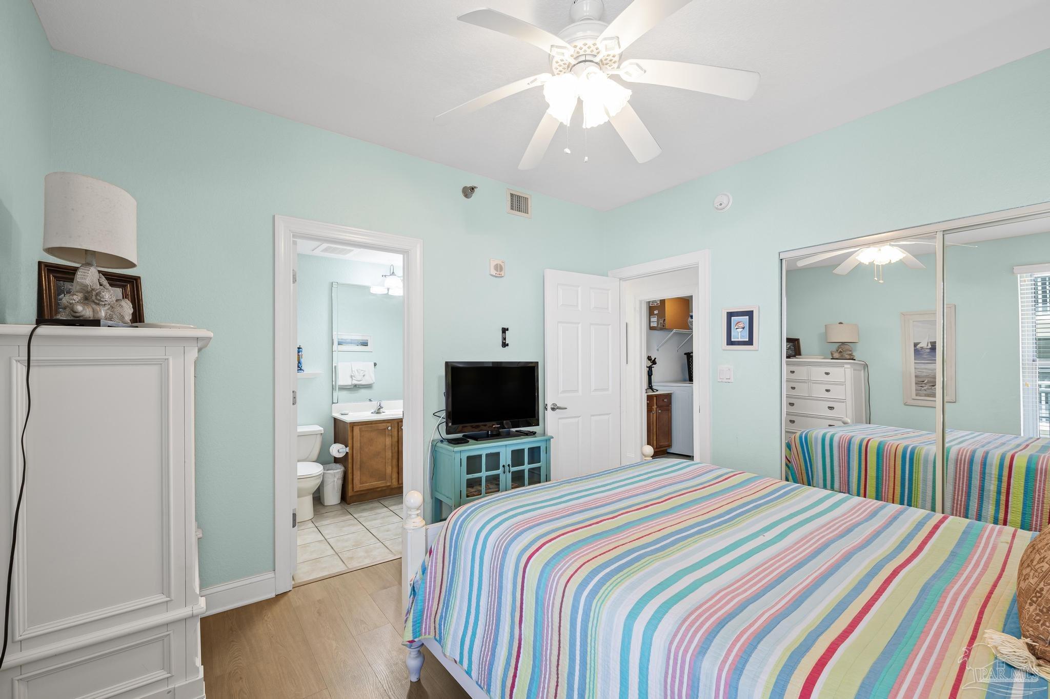 850 Fort Pickens Road, Unit 1230 Pensacola Beach, FL 32561 - Photo 13 of 67 a bedroom with a bed and a flat tv screen on dresser