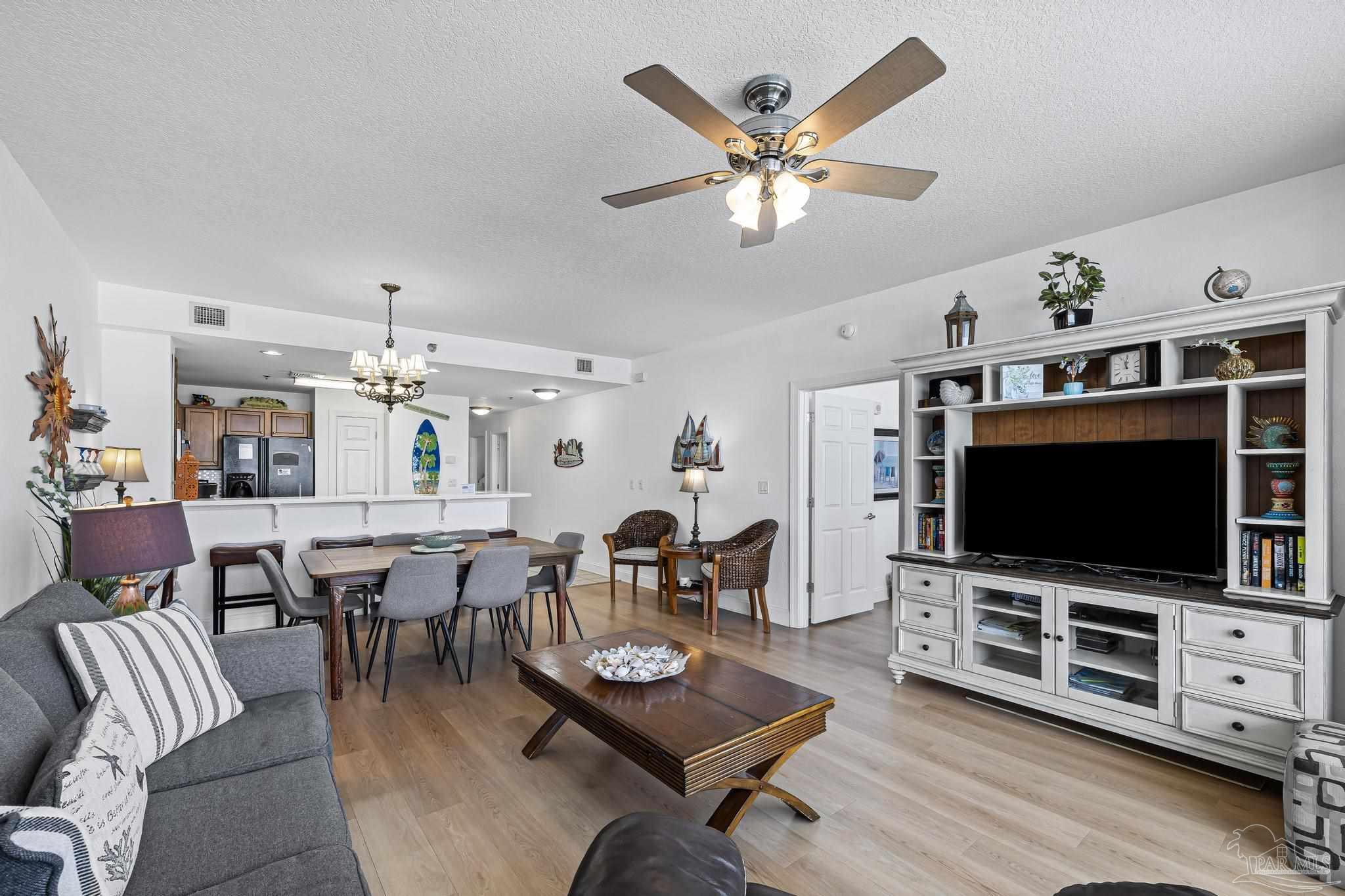 850 Fort Pickens Road, Unit 1230 Pensacola Beach, FL 32561 - Photo 24 of 67 a living room with furniture and a flat screen tv