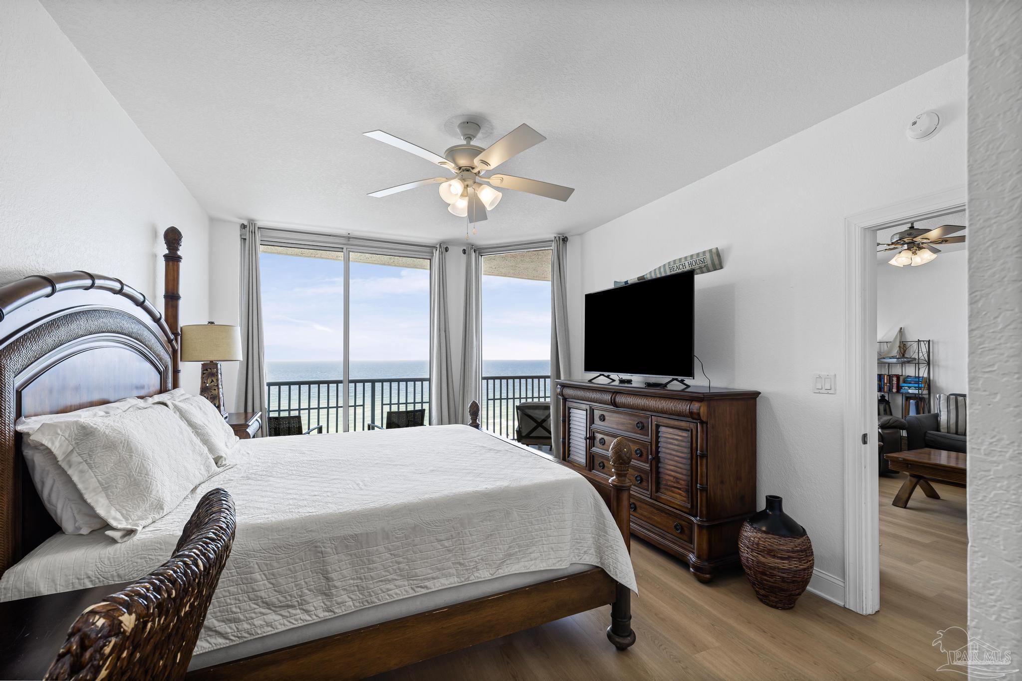 850 Fort Pickens Road, Unit 1230 Pensacola Beach, FL 32561 - Photo 26 of 67 a bedroom with a bed and a flat screen tv