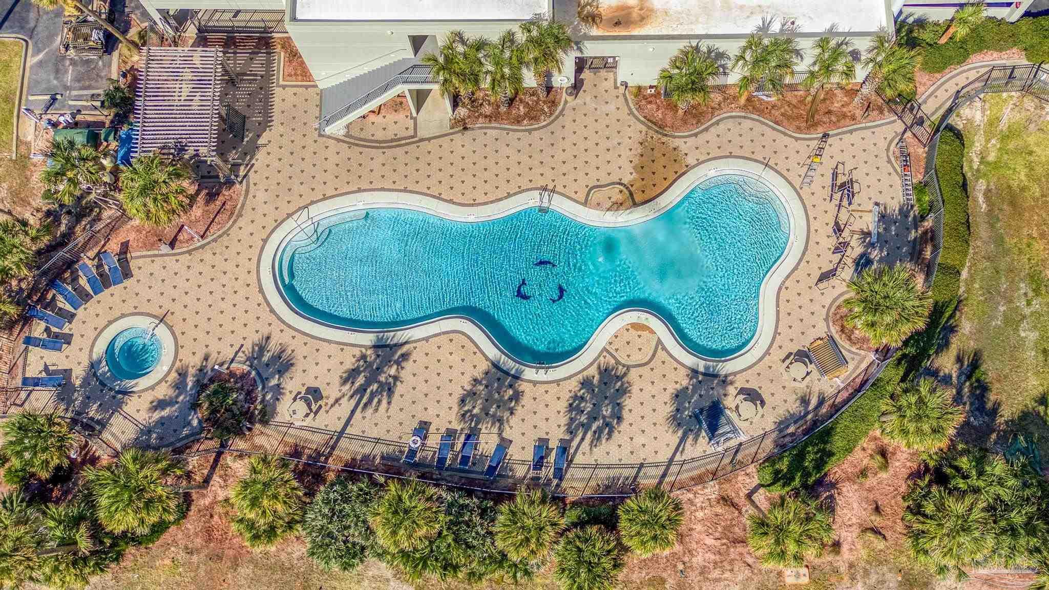 850 Fort Pickens Road, Unit 1230 Pensacola Beach, FL 32561 - Photo 52 of 67 an aerial view of a swimming pool patio swimming pool and outdoor seating