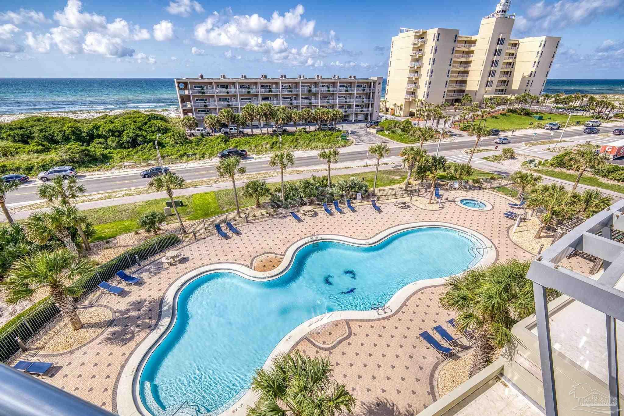 850 Fort Pickens Road, Unit 1230 Pensacola Beach, FL 32561 - Photo 6 of 67 a view of a swimming pool and outdoor space