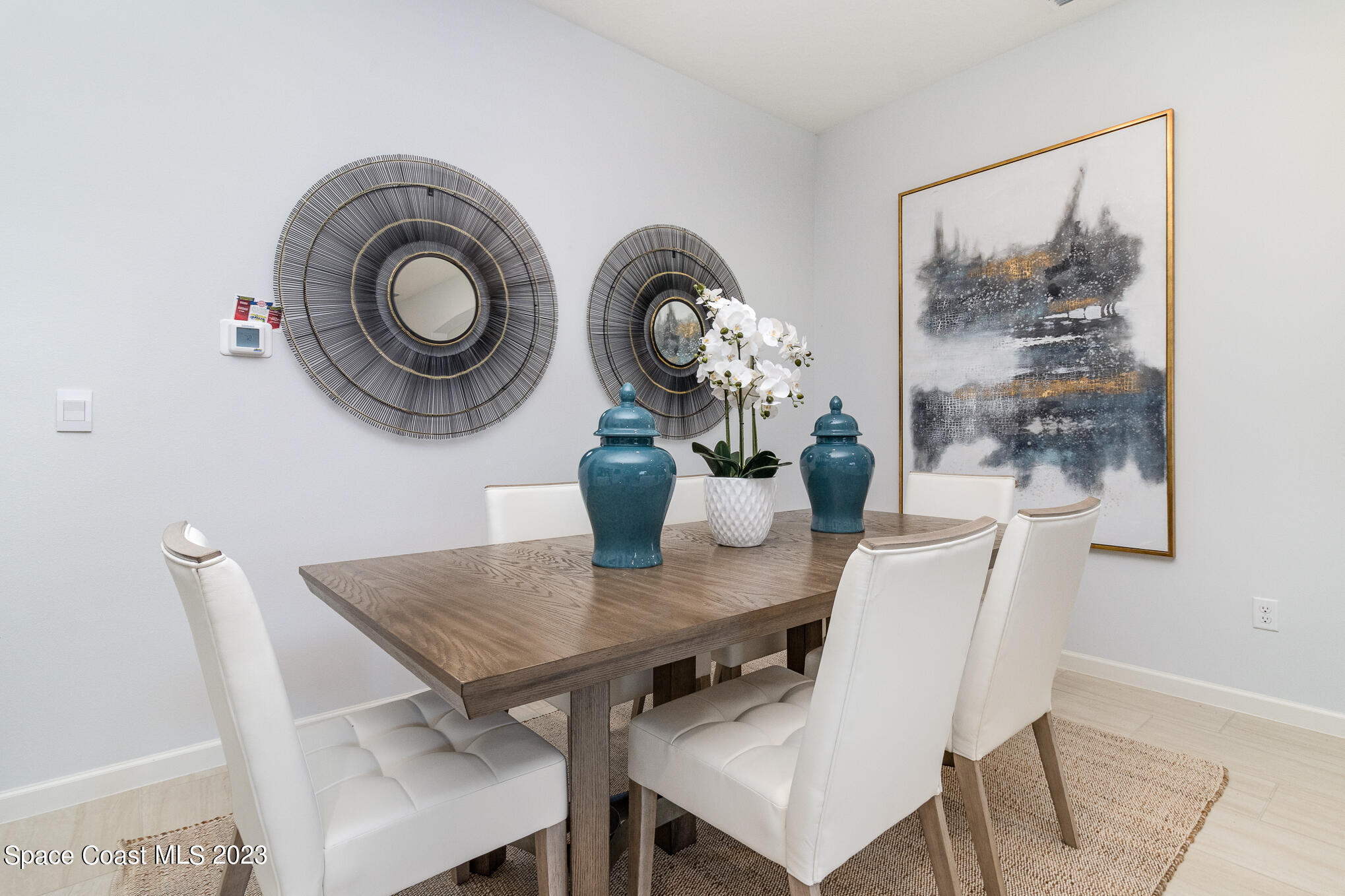 6901 Cameo Drive Grant, FL 32949 - Photo 3 of 48 a view of a dining room with furniture and chandelier