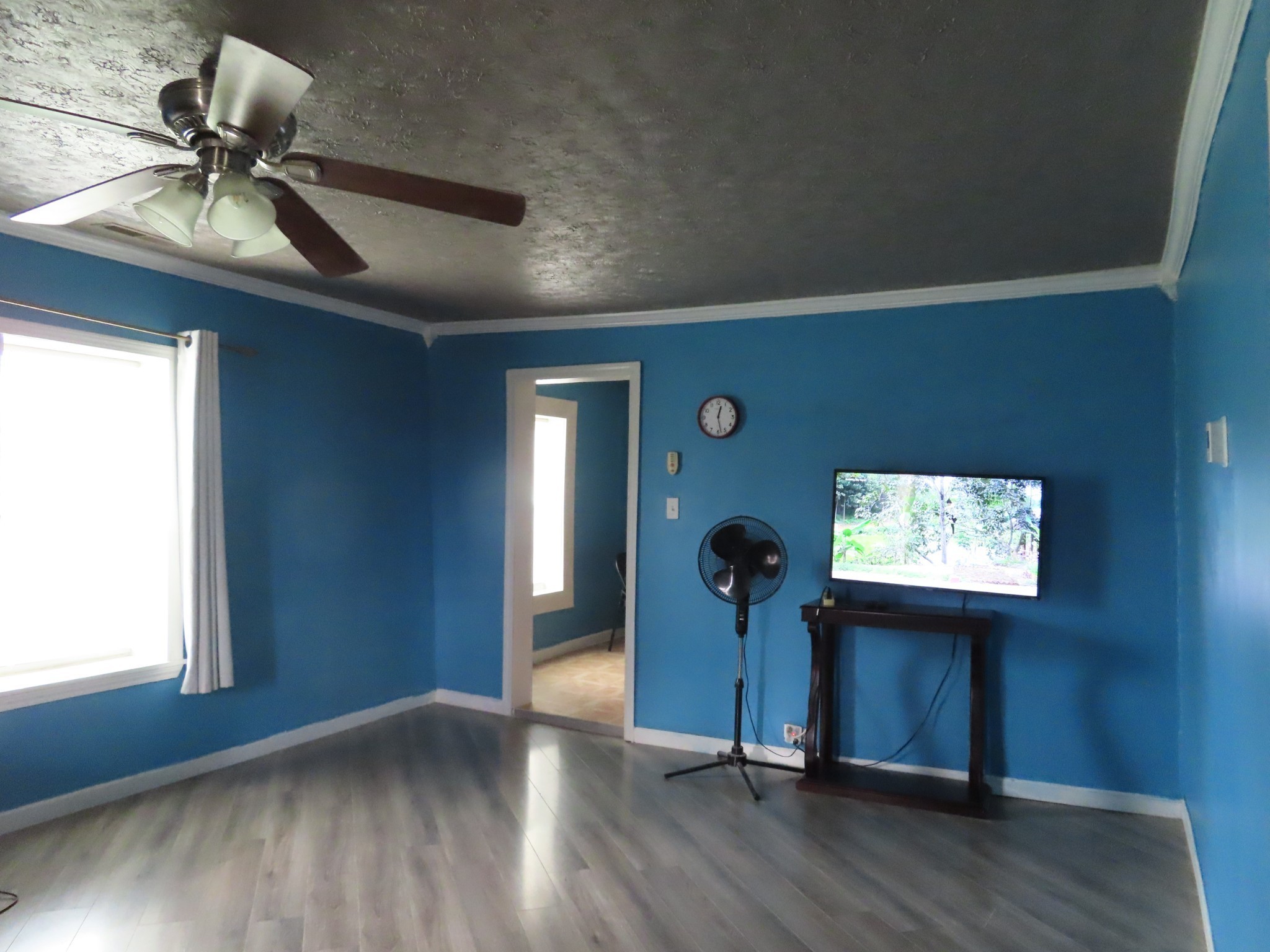 1263 Union Camp Road Lafayette, TN 37083 - Photo 11 of 22 an empty room with wooden floor fan and windows