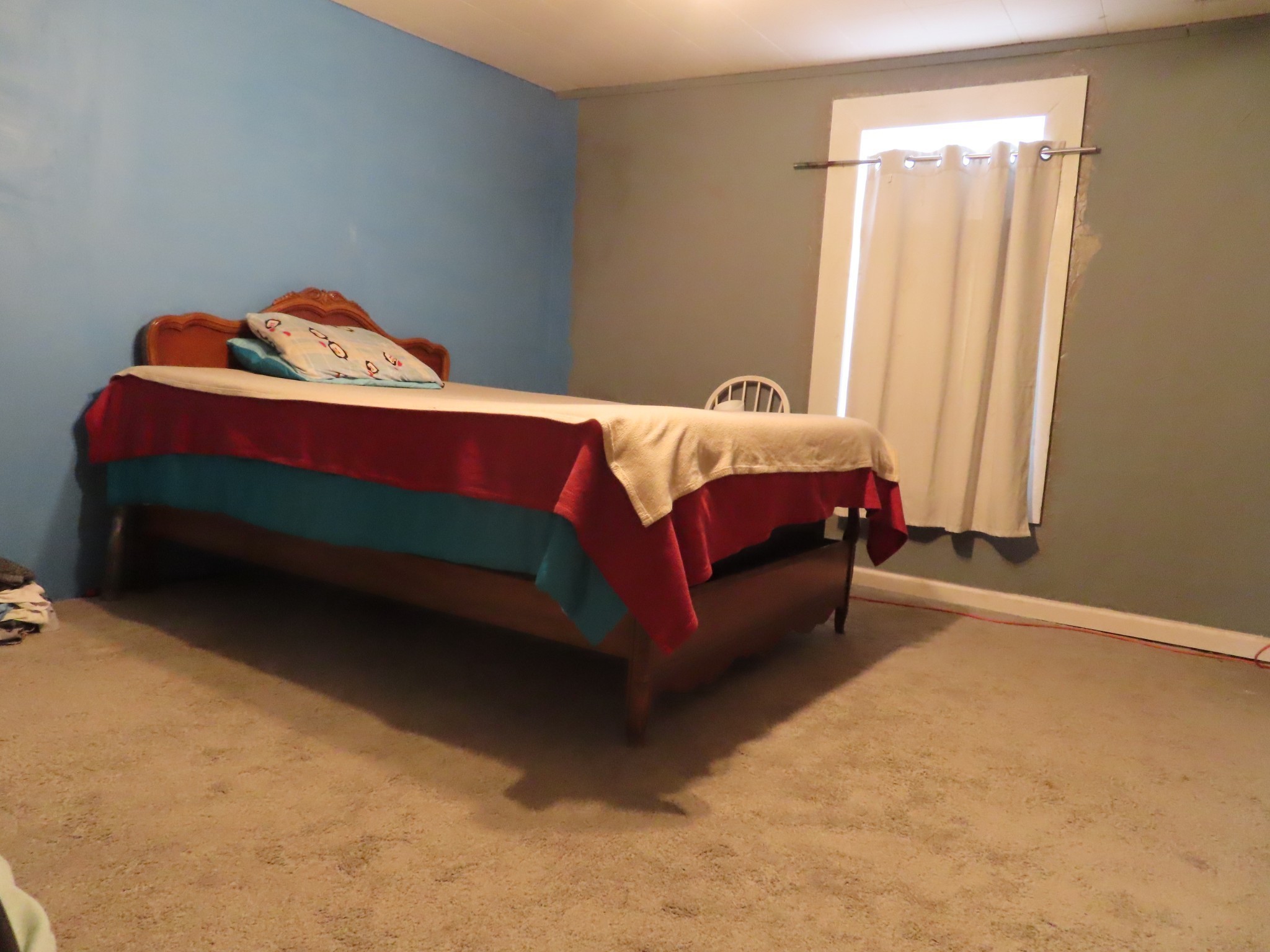 1263 Union Camp Road Lafayette, TN 37083 - Photo 12 of 22 a bed sitting in a bedroom next to a window