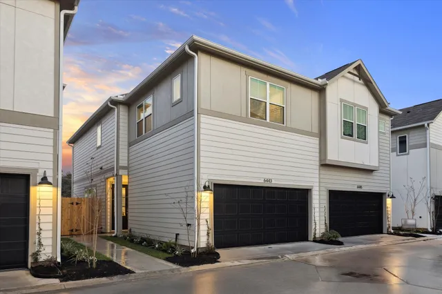 a front view of a house with a garage