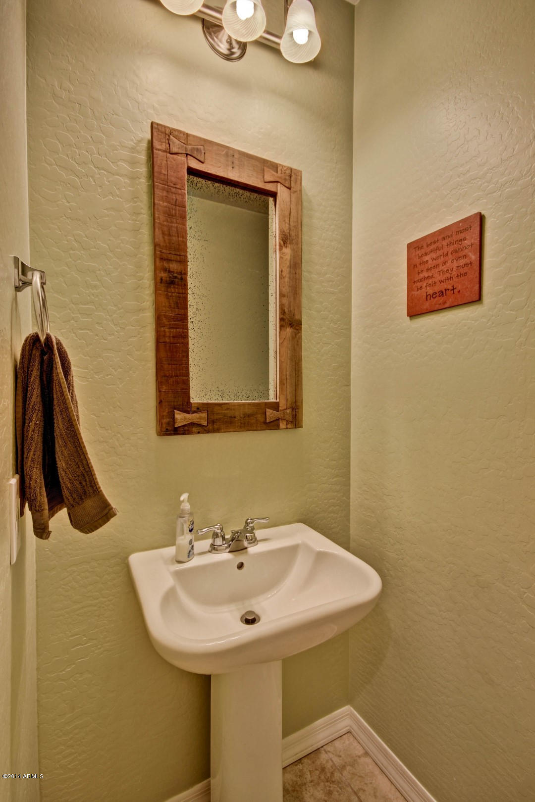 2280 North Alsap Road Buckeye, AZ 85396 - Photo 12 of 65 a bathroom with a sink a mirror and vanity