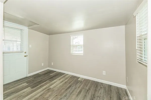 a view of a livingroom with a ceiling fan and window