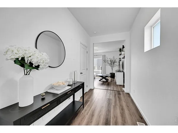 a view of a living room and entryway