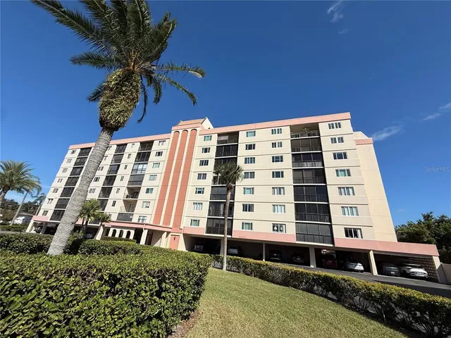 a front view of a building with a yard