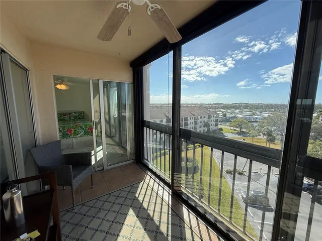 a bathroom with a toilet and a mirror