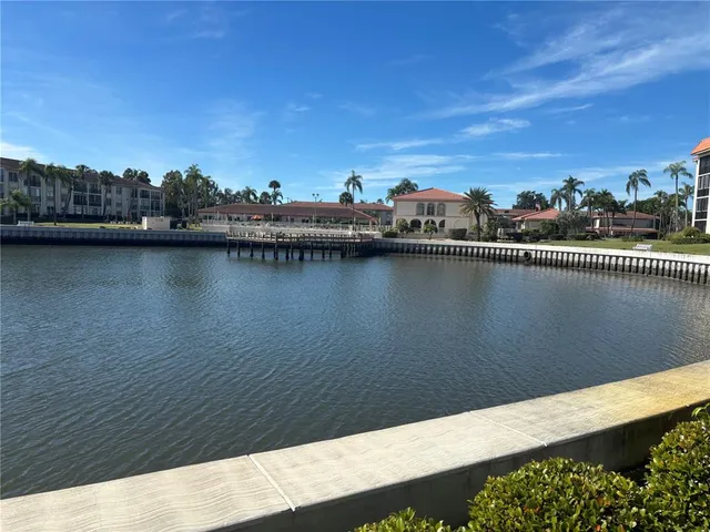 a view of a brick building next to a yard