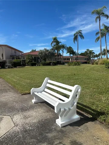 a view of outdoor space with swimming pool and lake view
