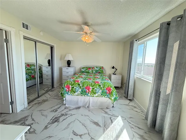 a bedroom with furniture and a baby crib