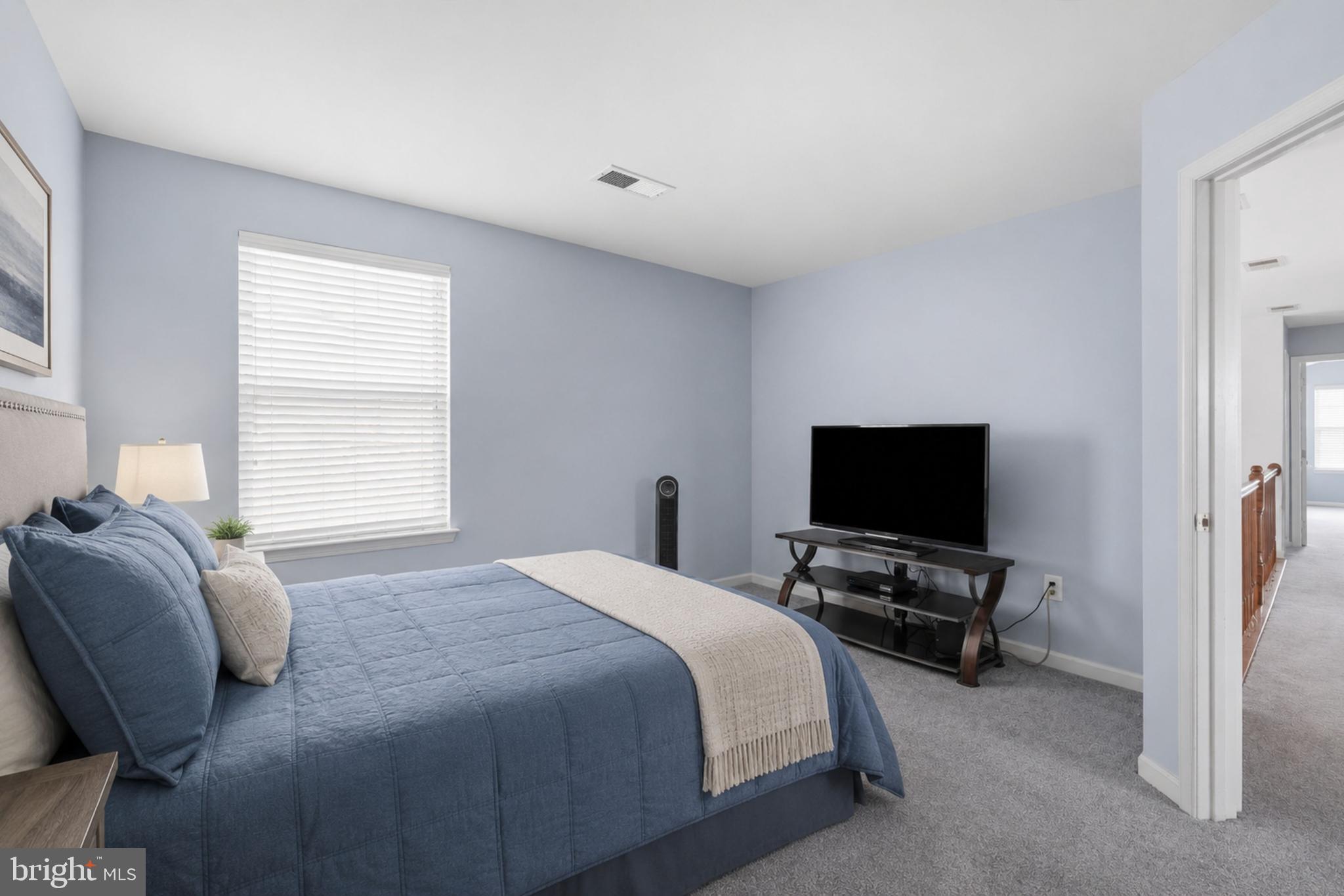 24 Overbrook Road Ranson, WV 25438 - Photo 13 of 21 a bedroom with a bed and a flat screen tv