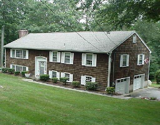 18 Inwood Road Norwalk, CT 06850 - Photo 1 of 1 a front view of a house with a garden