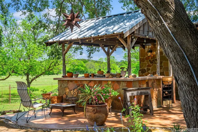 a view of an outdoor space with a table and chairs