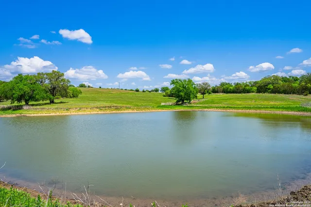 a view of a lake with a big yard