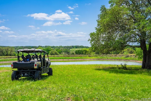 a view of swimming pool with seating area and garden