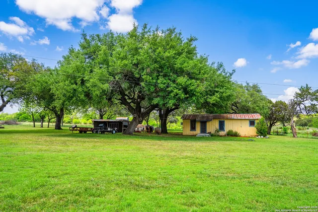 a view of a house with a big yard
