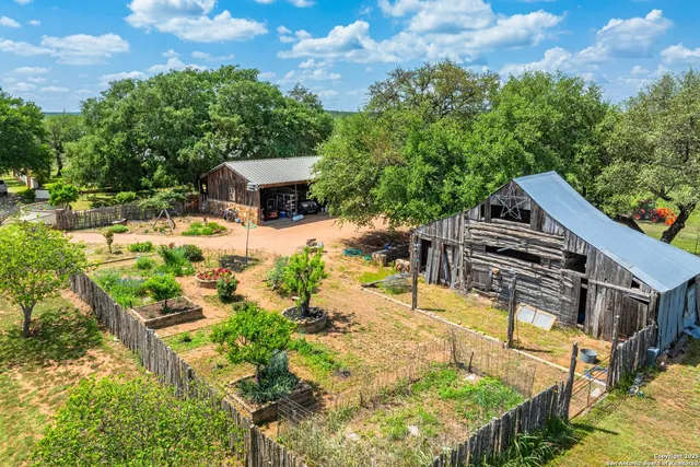a view of a backyard with sitting area