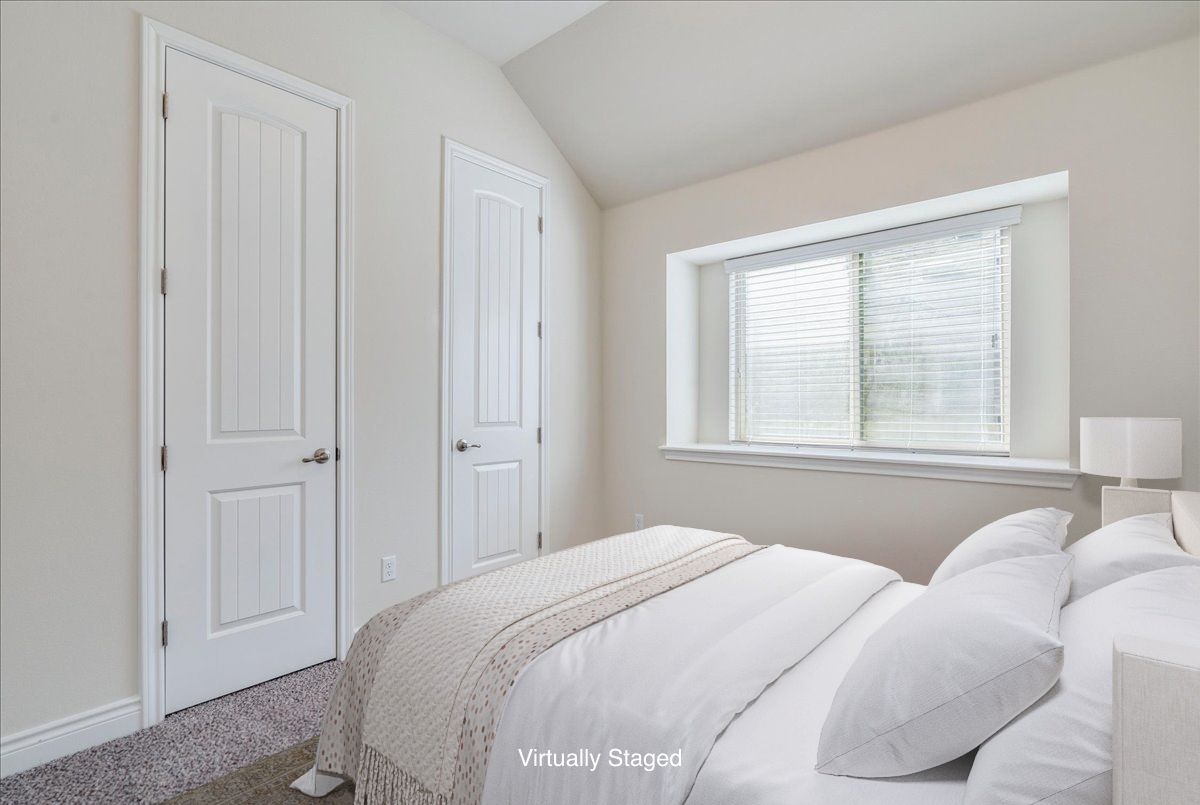 124 Compass Lane Kyle, TX 78640 - Photo 20 of 38 a bedroom with a bed and a window