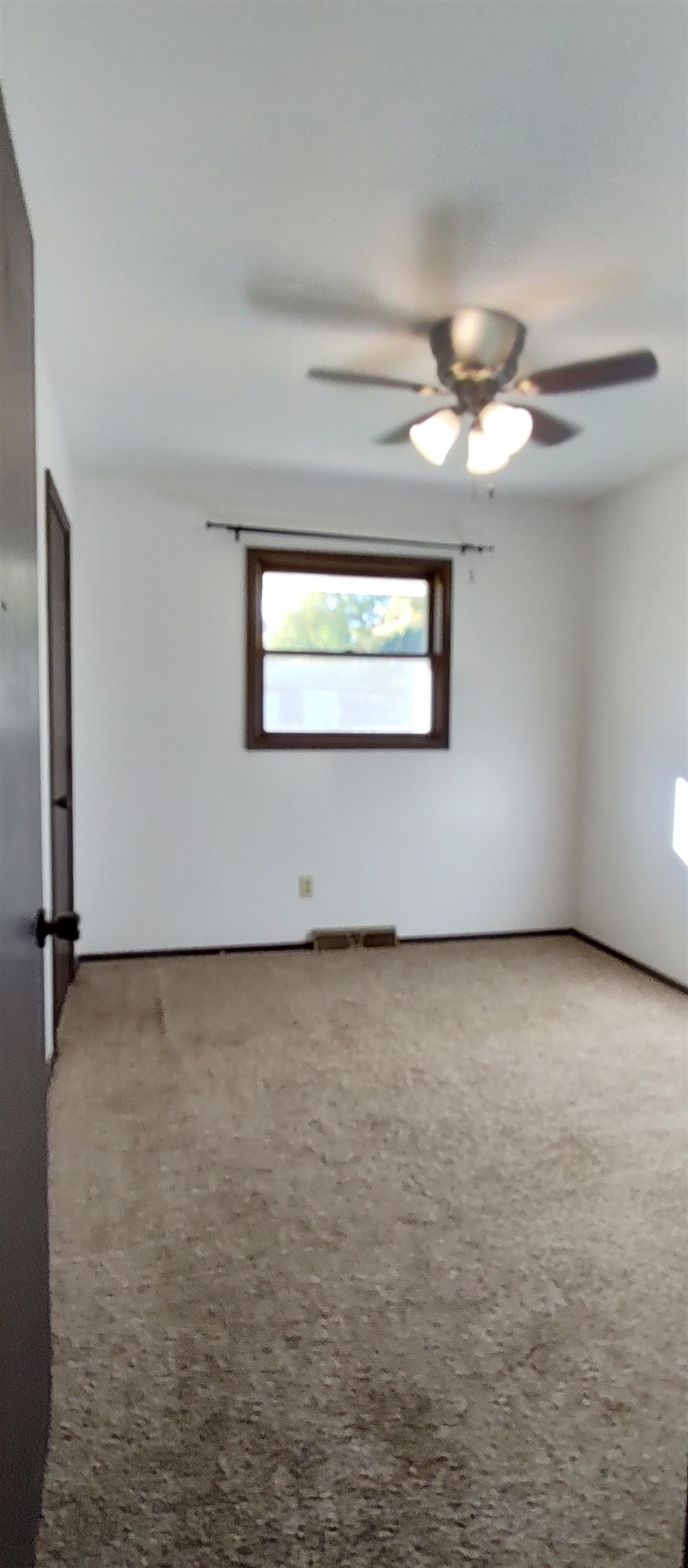 4466 Brookdale Road Rockford, IL 61109 - Photo 28 of 43 a view of an empty room with a window