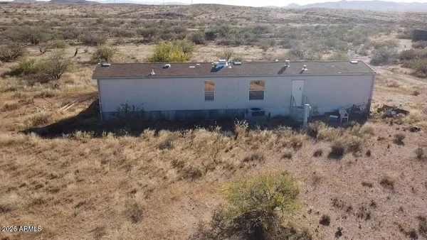 an aerial view of house with yard