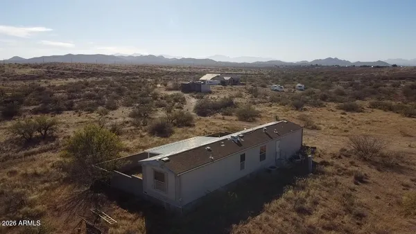 an aerial view of residential house and outdoor space