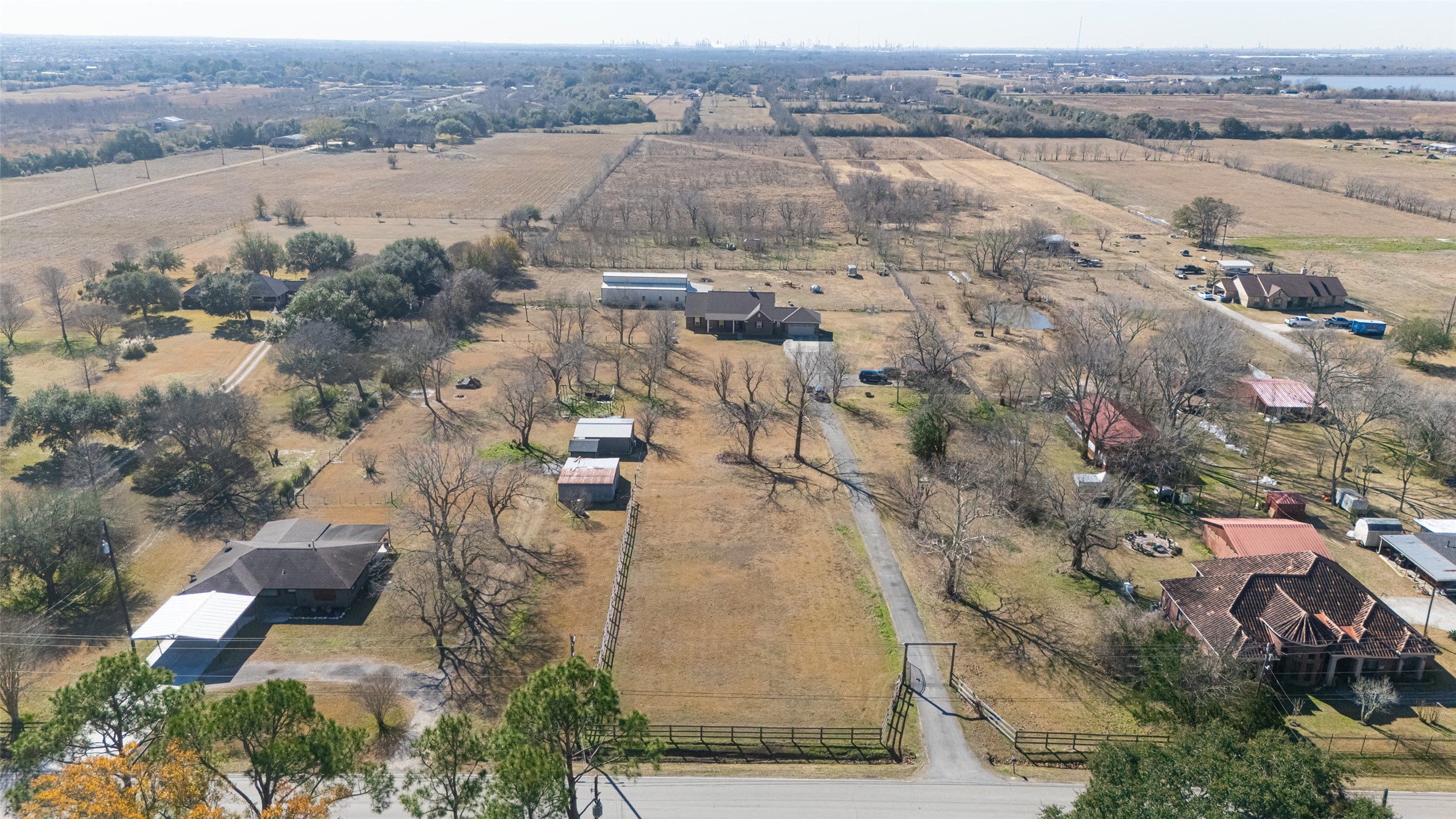 3418 Barbers Hill Road Highlands, TX 77562 - Photo 44 of 50 an aerial view of residential house with outdoor space and lake view