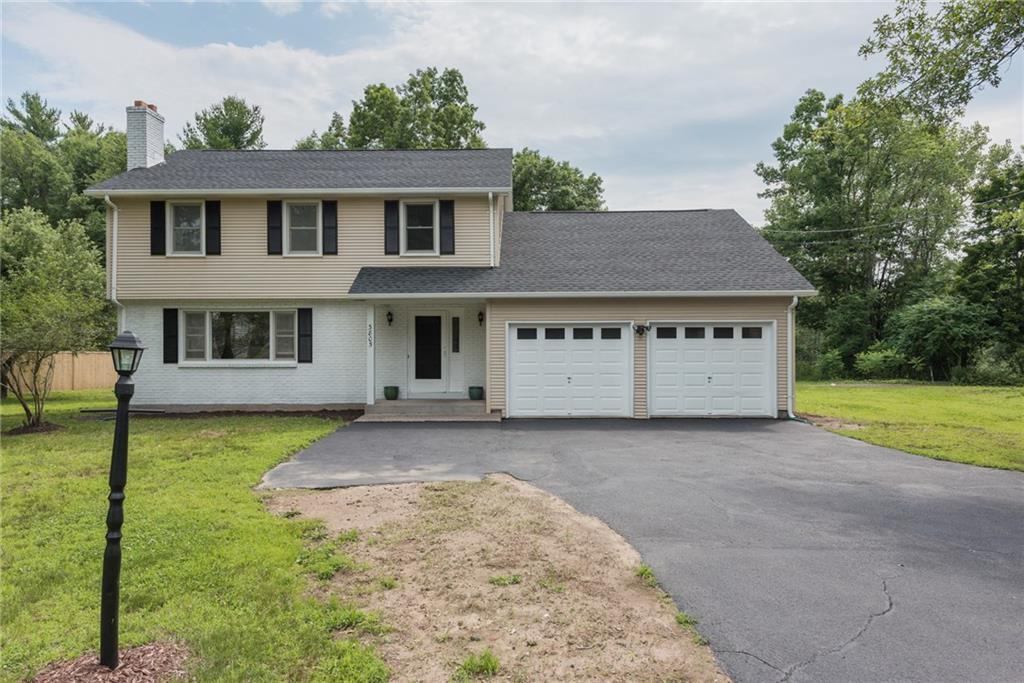 3805 Mountain Road Suffield, CT 06093 - Photo 1 of 1 a view of a house with garden and trees