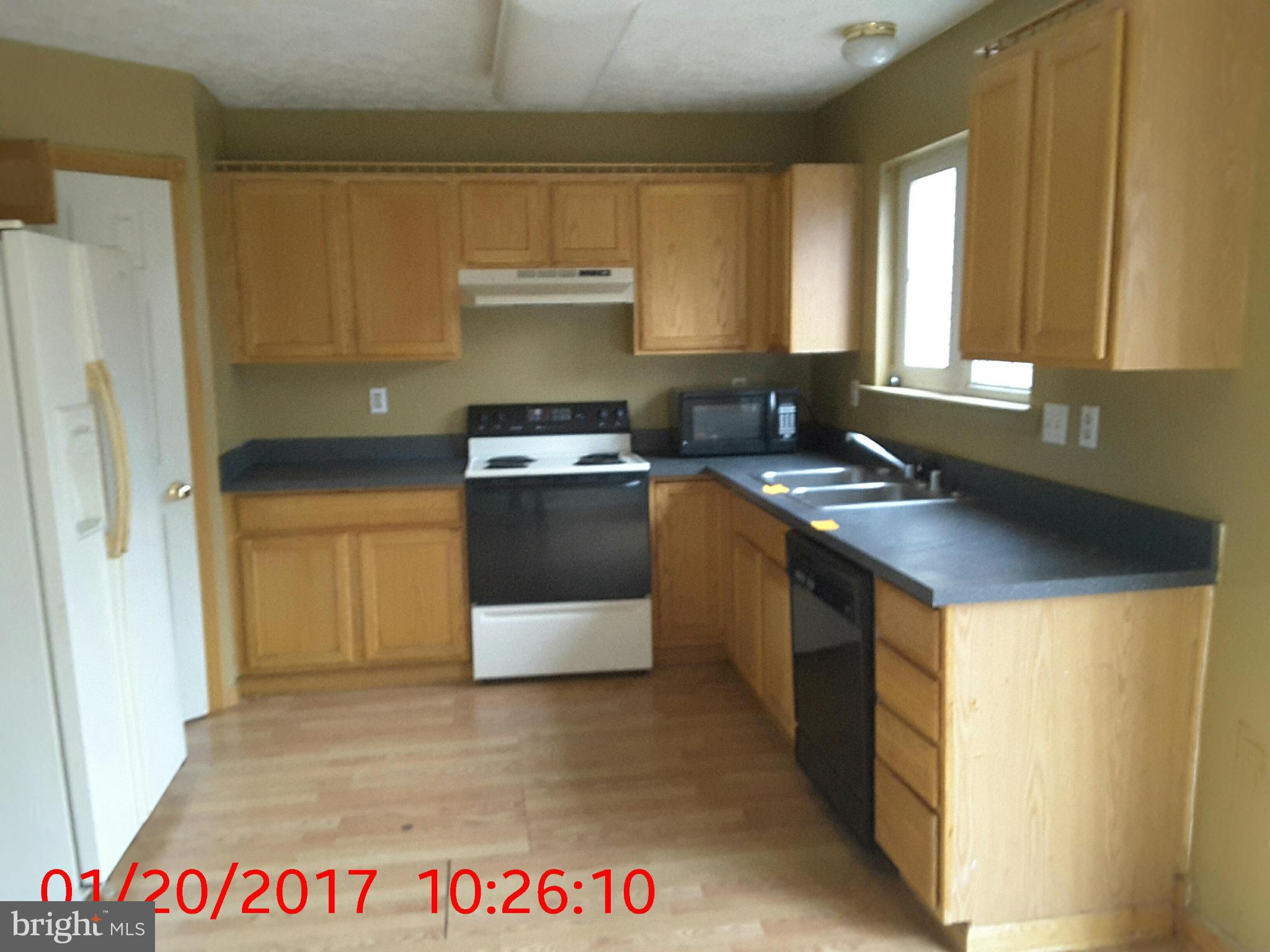 2406 Beaver Crossing Road Edgewood, MD 21040 - Photo 2 of 18 a kitchen with granite countertop a sink a stove and refrigerator