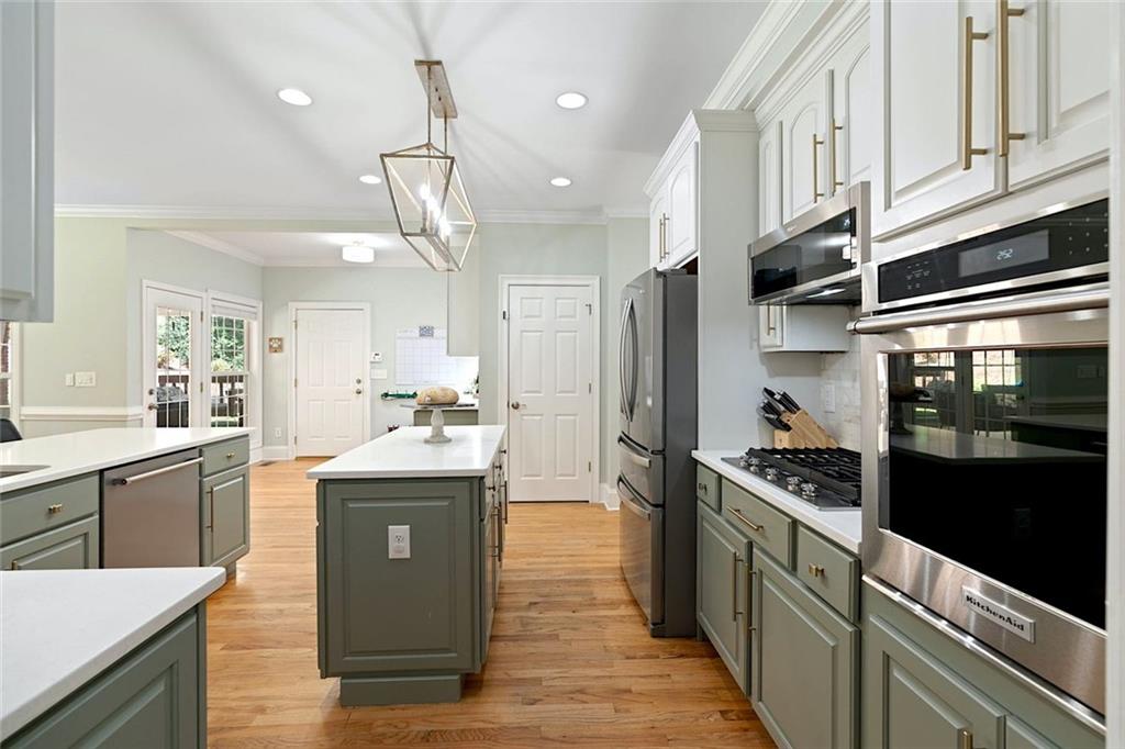 3095 Chattahoochee Trace Gainesville, GA 30506 - Photo 11 of 37 a kitchen with stainless steel appliances granite countertop a refrigerator a stove and a sink