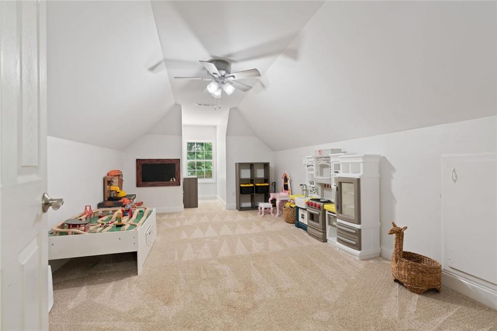 3095 Chattahoochee Trace Gainesville, GA 30506 - Photo 22 of 37 a living room with furniture and a fireplace