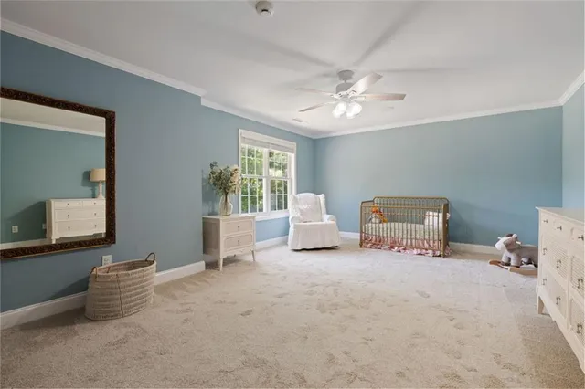 an aerial view of house with yard and mountain in the back