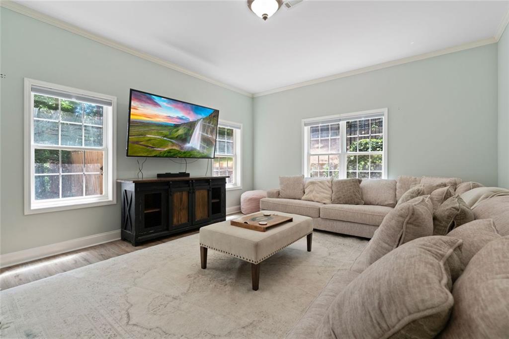 3095 Chattahoochee Trace Gainesville, GA 30506 - Photo 26 of 37 a living room with furniture and a flat screen tv