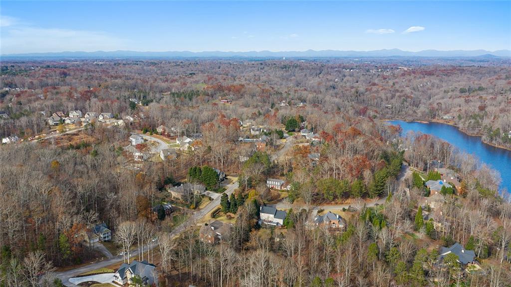 3095 Chattahoochee Trace Gainesville, GA 30506 - Photo 32 of 37 an aerial view of house with yard and mountain in the back