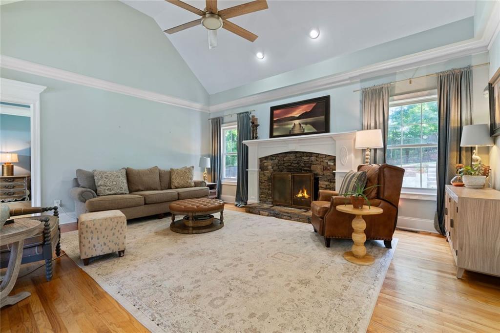 3095 Chattahoochee Trace Gainesville, GA 30506 - Photo 6 of 37 a living room with furniture and a fireplace
