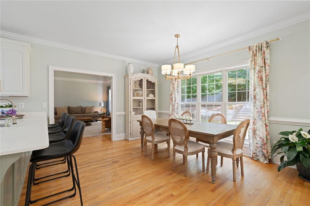 3095 Chattahoochee Trace Gainesville, GA 30506 - Photo 10 of 37 a view of a dining room with furniture window and wooden floor