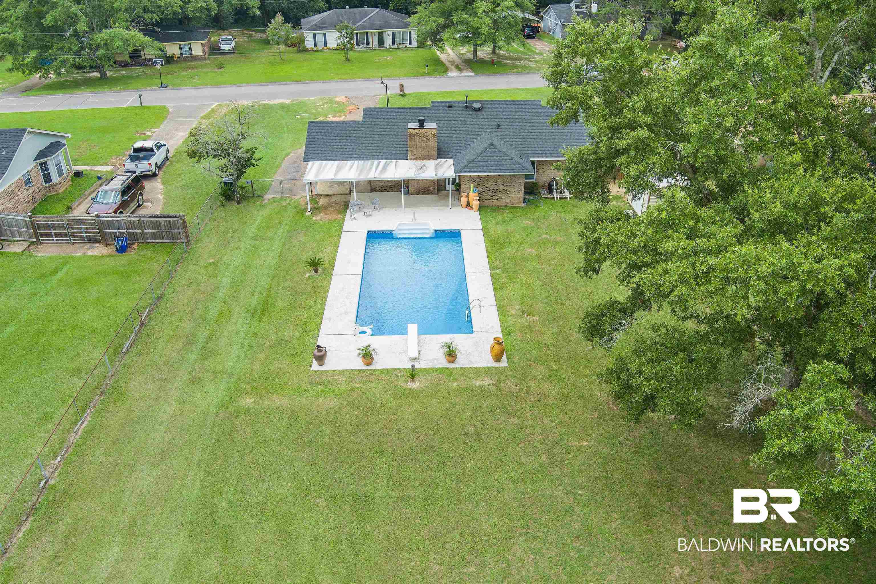 2000 Campfire Drive Semmes, AL 36575 - Photo 4 of 26 View of pool featuring a yard and an outbuilding